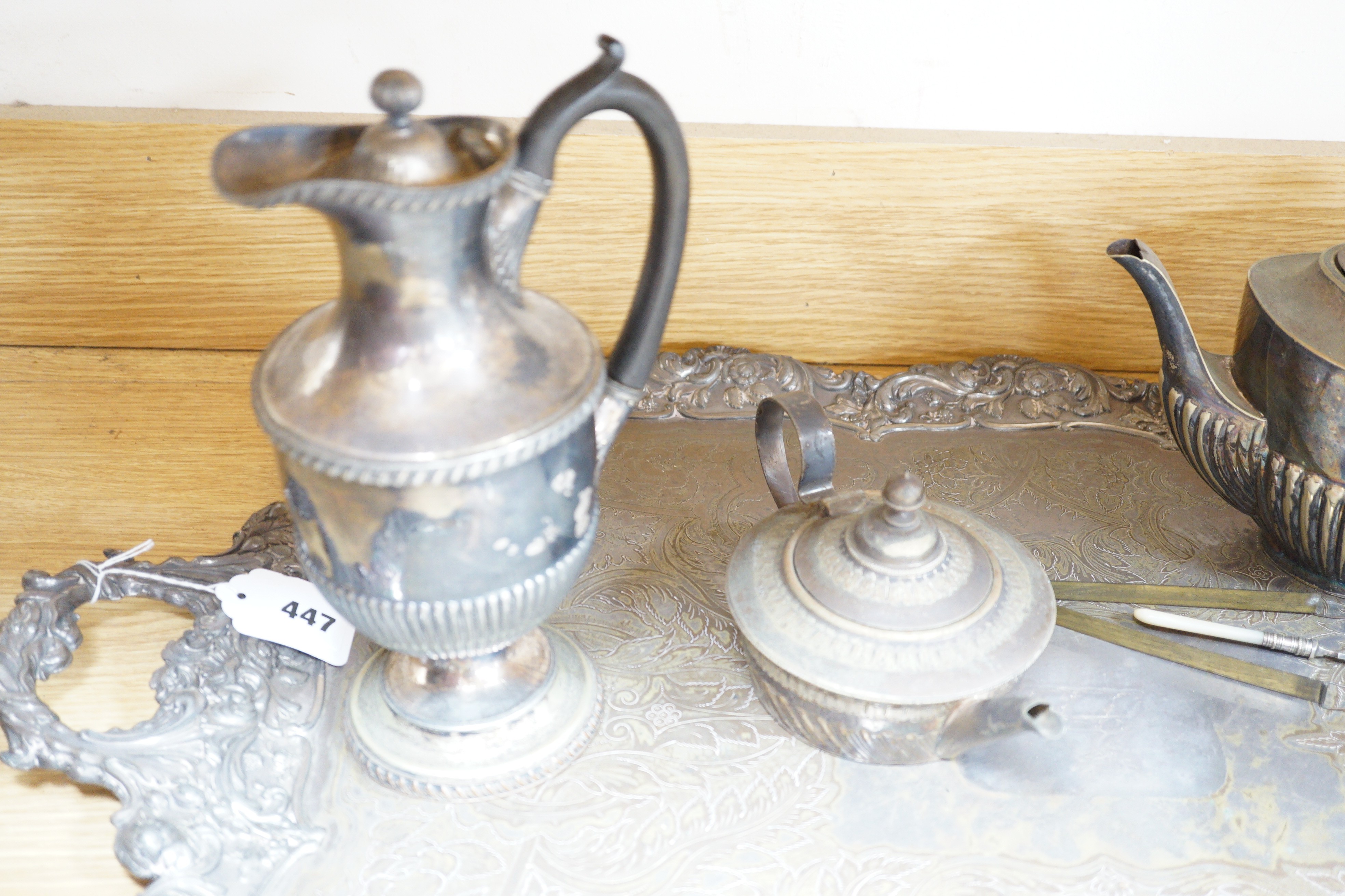 A silver plated two handled tea tray and seven other plated items, tray length 80cm